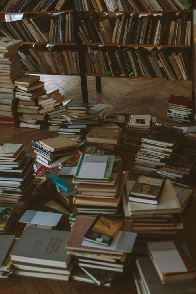 Books on Brown Wooden Shelf